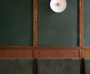 Greenery on the walls and upholstered seats