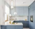 Blue kitchen with gold accessories