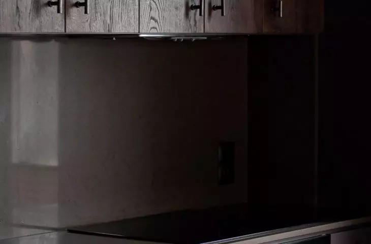 Wabi-sabi apartment, dark kitchen