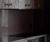 Wabi-sabi apartment, dark kitchen