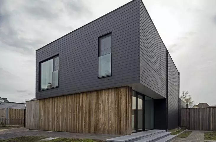 Facade covered with Cedral small format tile in graphite color (horizontal covering)  