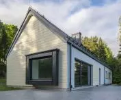 House in Kashubia, parts of the facade were covered with Cedral LAP WOOD board in beige color  