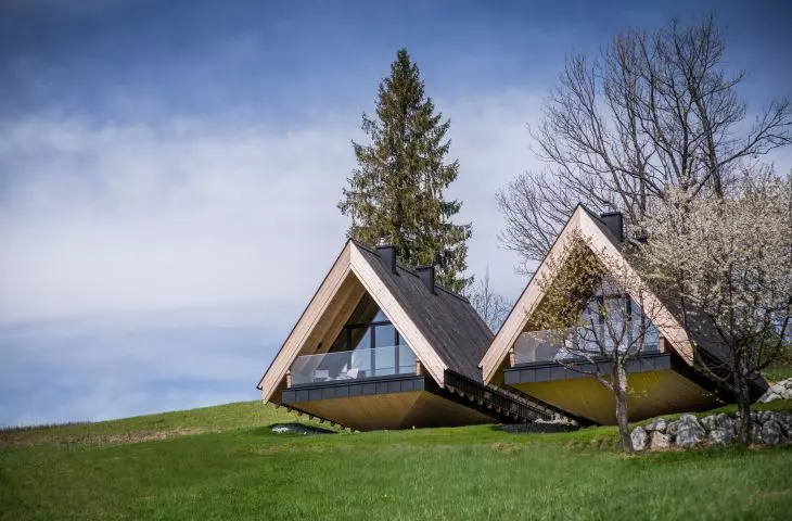 The houses are reminiscent of mountain huts in appearance
