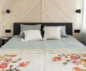 Bedroom and spruce wood wall 