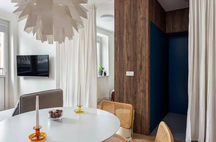 view from the dining room to the navy blue hallway