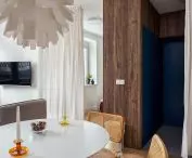 view from the dining room to the navy blue hallway