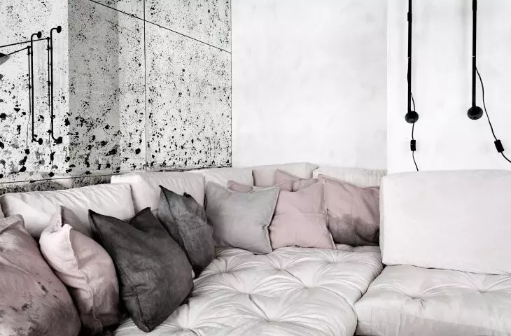 Sofa and mirrored wall in living room