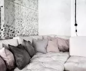 Sofa and mirrored wall in living room