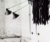Black lamps and macramé in the living room