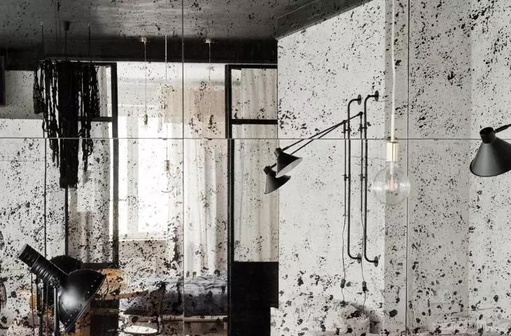 A wall of mirrors in the living room