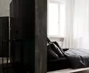 A partition wall in the bedroom and a dressing room behind it