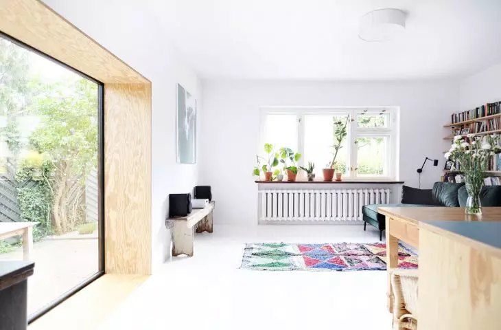 white walls, ceiling and floor are the background for a variety of furnishings