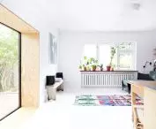 white walls, ceiling and floor are the background for a variety of furnishings
