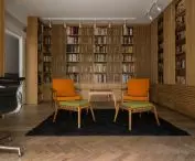 on the first floor there is an impressive library housing a collection of nearly ten thousand books in total