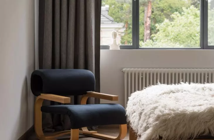 finely curved armchair designed by Jan Bočan