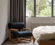 finely curved armchair designed by Jan Bočan