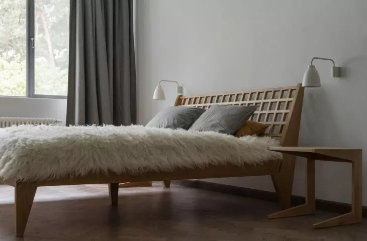 Bed in the bedroom designed by Loft Kolasinski