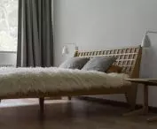 łóżko w sypialni projektu Loft Kolasińki