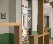 glass showcase in the living room and openwork wall in the dining room
