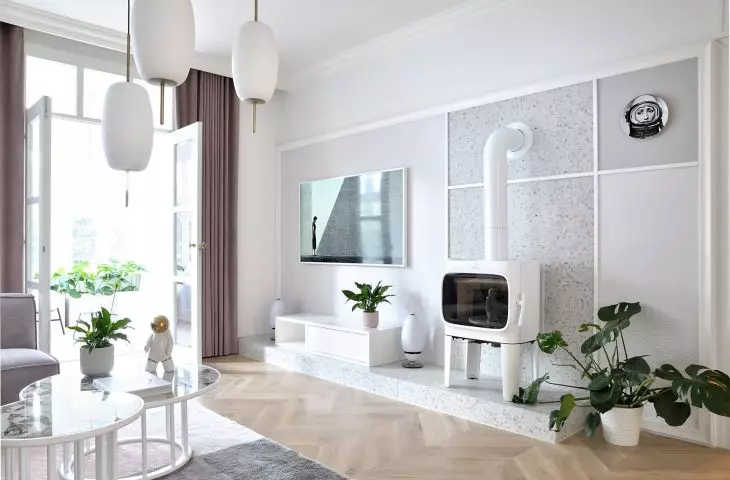 the living room is decorated with a fireplace of unusual shape