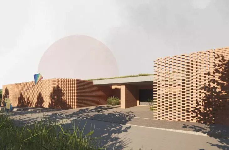INvisible house z ceglaną, ażurową elewacją