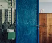 Blue doors lead to the bathroom