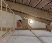 Fragment of a mezzanine with a bed
