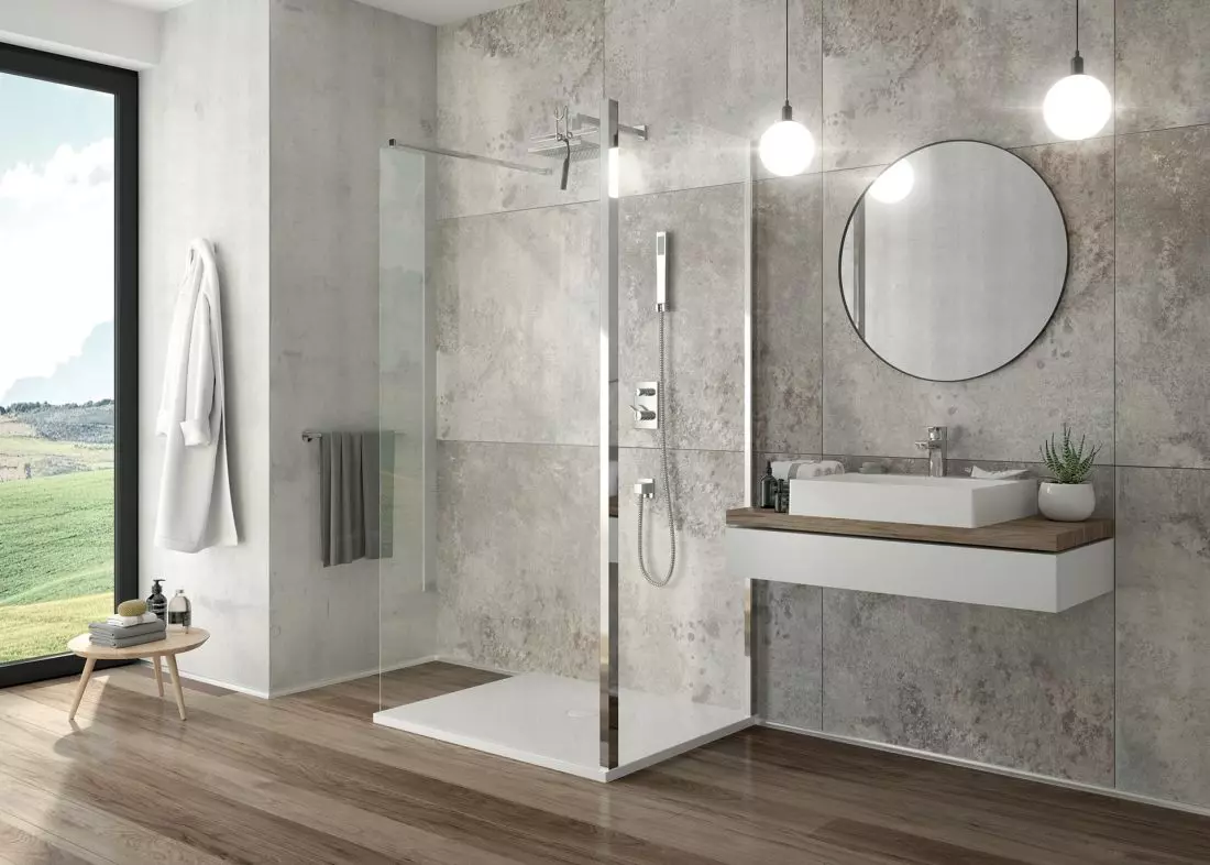 Kabina przyścienna na
bazie kabiny typu Walk-In i ścianki bocznej serii TX5b z brodzikiem serii Open Mineral oraz umywalka Free Mineral © SANPLAST