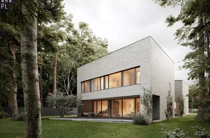 Panoramic glazing invites the forest inside the house