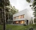 Panoramic glazing invites the forest inside the house