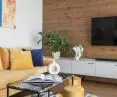 Wooden wall and golden poufs
