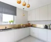 White kitchen and gold accessories