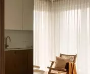 A section of the kitchen is reflected in the mirror