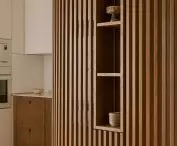 Wooden cabinet introduces a vertical rhythm