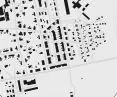 regular urban layout with two- and three-storey buildings located along the streets