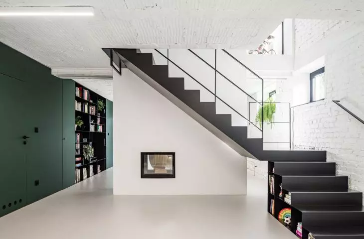 black staircase contrasts with light-colored walls