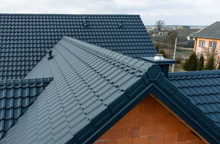 Roof complete with Venecja D-Matt 7016 modular tile roof finished with GS-LUX ridge and Venecja modular wind vane