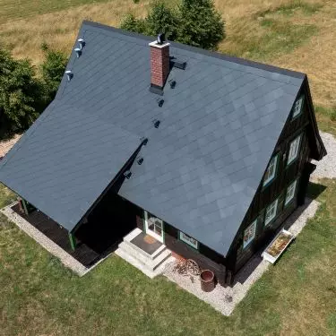 House in New Waliszów, roof made of Cedral tiles in graphite color, French roofing