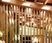 The body is formed by openwork walls of vertically arranged larch boards