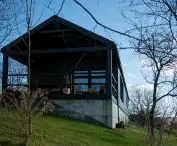 The house is located on a steep plot of land