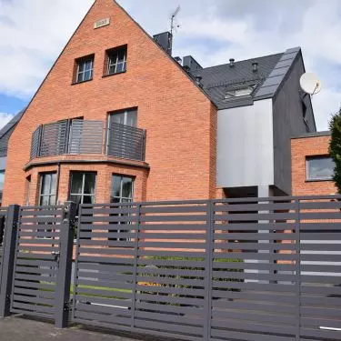 Facade of the building made of hand-formed traditional aged brick