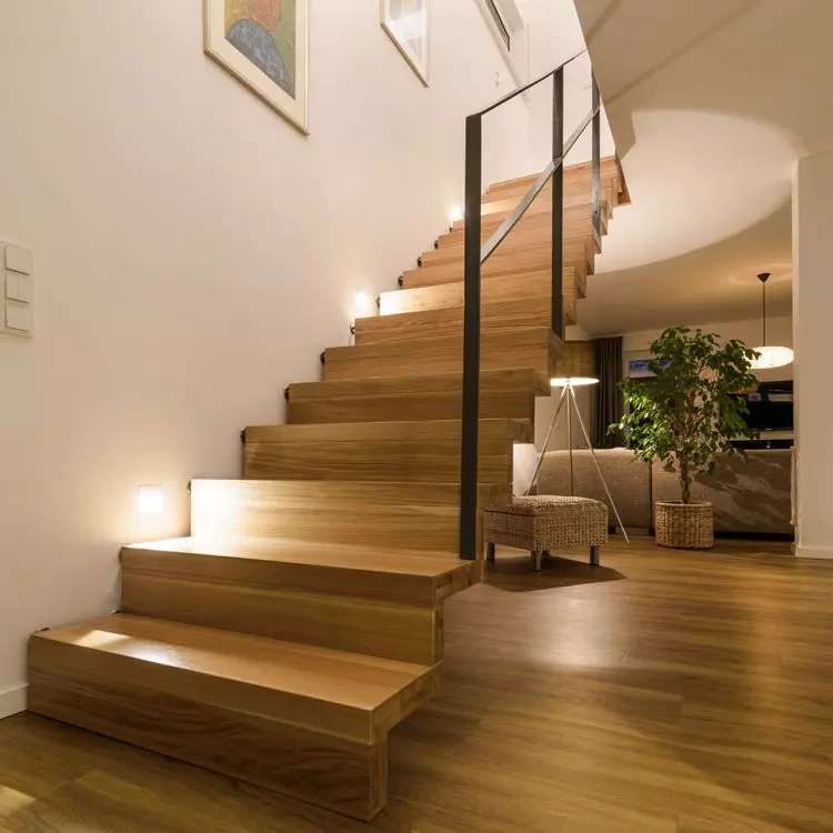 Carpeted staircase made of oiled oak. Powder-coated steel balustrade. Realization private house.