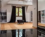 Divide rooms by using tiles in the dressing room and parquet flooring in the room