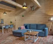 Tleń Lodge in Bory Tucholskie, interiors made of wood and brick