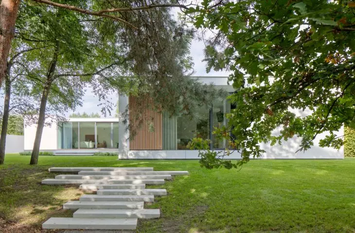 House K with a shot of the stairs on the side of the greenery