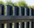 Front rail fence. Made of galvanized sheet metal, powder coated, in anthracite color. This is a popular model, often chosen as a fence for private properties. The photo shows the view from the side of the property