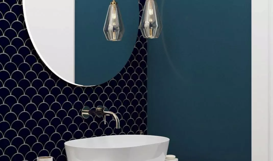 The blue is the paint and fish scale tiles on some walls and the tiles on the bathroom floor.
