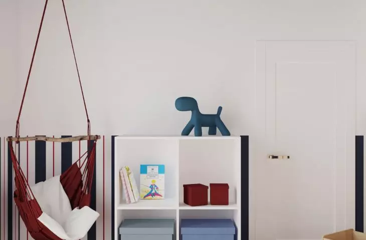 One corner of the room has been provided for a playground with storage for the toddler's treasures, a swing and a rug. 