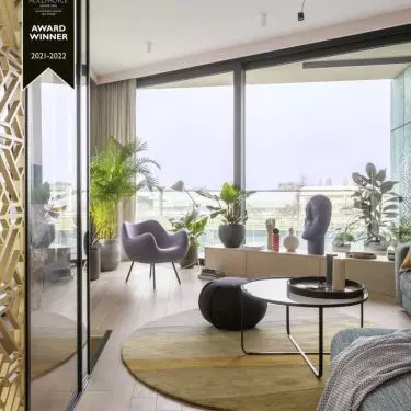 A round rug highlights the lounge area.