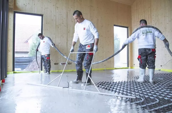 Baumit Alpha 2500 self-leveling floor underlayment system with prefabricated slab with tabs for installation of heating pipes